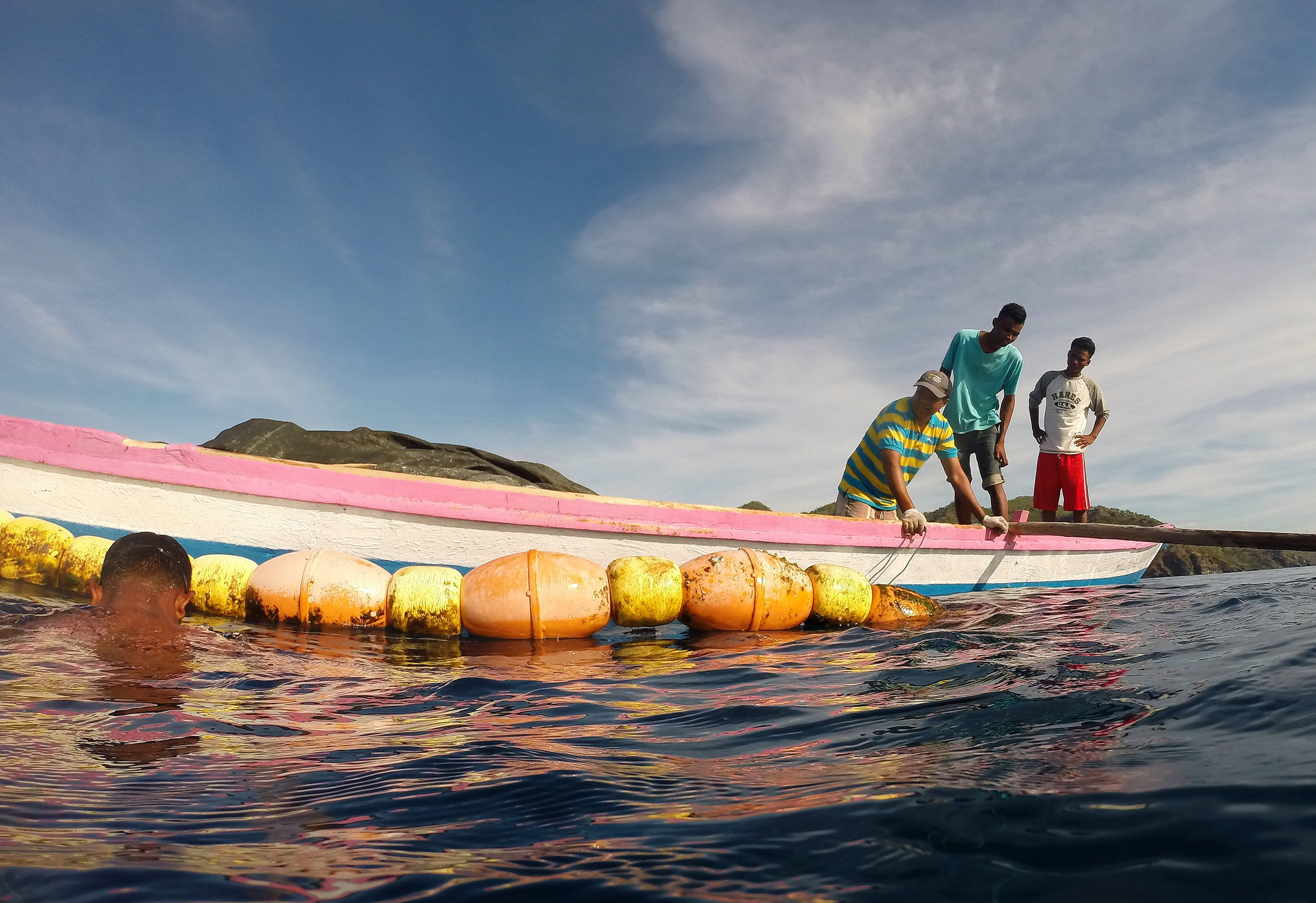 Checking a fish aggregating device (FAD), Timor-Leste. 2016. Photo by Alex Tilley.