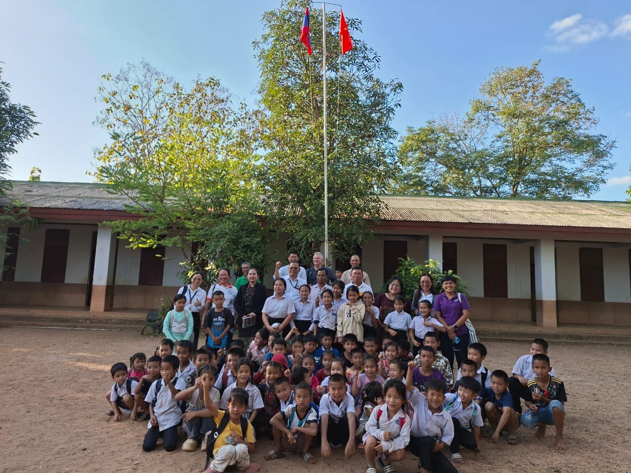 Students and researchers at Nahoy Primary School during a field visit exploring community-led approaches to school meals in Laos.