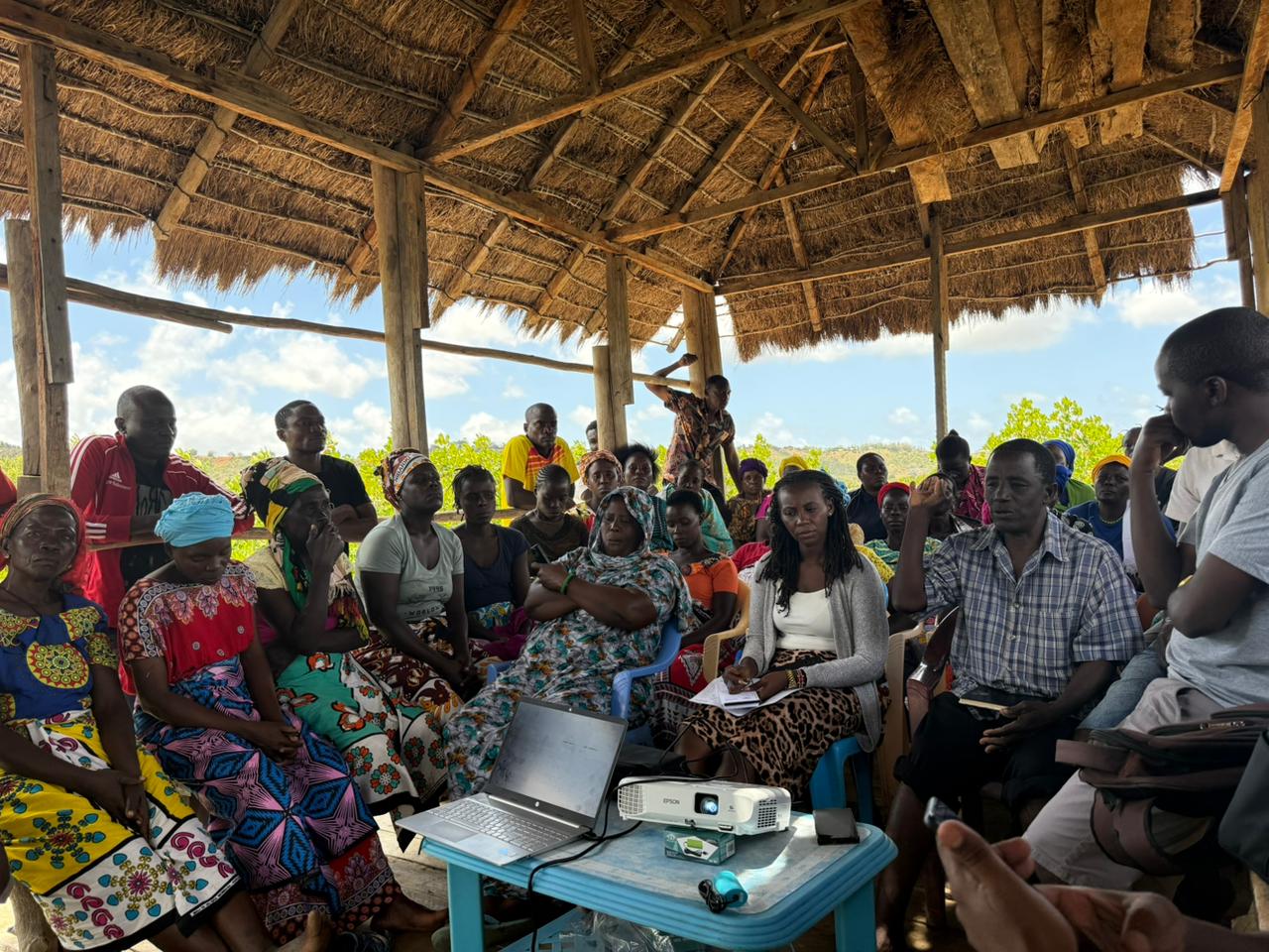 Farmers from the Umoja Self-Help Group pilot site (Kibokoni, Kilifi County) actively engage in a training session, attentively following the facilitator’s presentation and participating in group.jpg