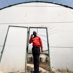 Wilbroad Musanshi at his farm in Mansa, Zambia, where integrated fish ponds support climate-smart aquaculture and diversified farming.