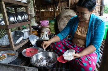 Daw Cho Mar preparing fish for breakfast, Myanmar. Photo:Majken Schmidt Søgaard/WorldFish. 