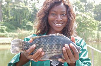 Happy youth entrepreneur, Nigeria. Photo by Adesanya Omotomiwa IITA and Olaniyi Ajibola, WorldFish.