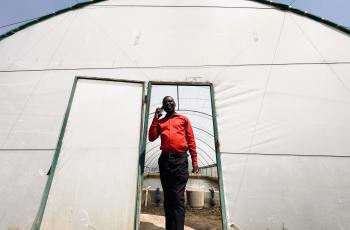 Wilbroad Musanshi at his farm in Mansa, Zambia, where integrated fish ponds support climate-smart aquaculture and diversified farming.